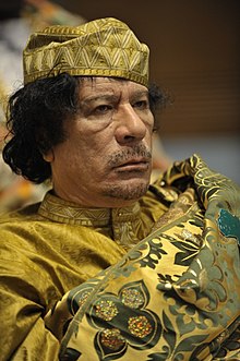 220px-Muammar_al-Gaddafi_at_the_AU_summit